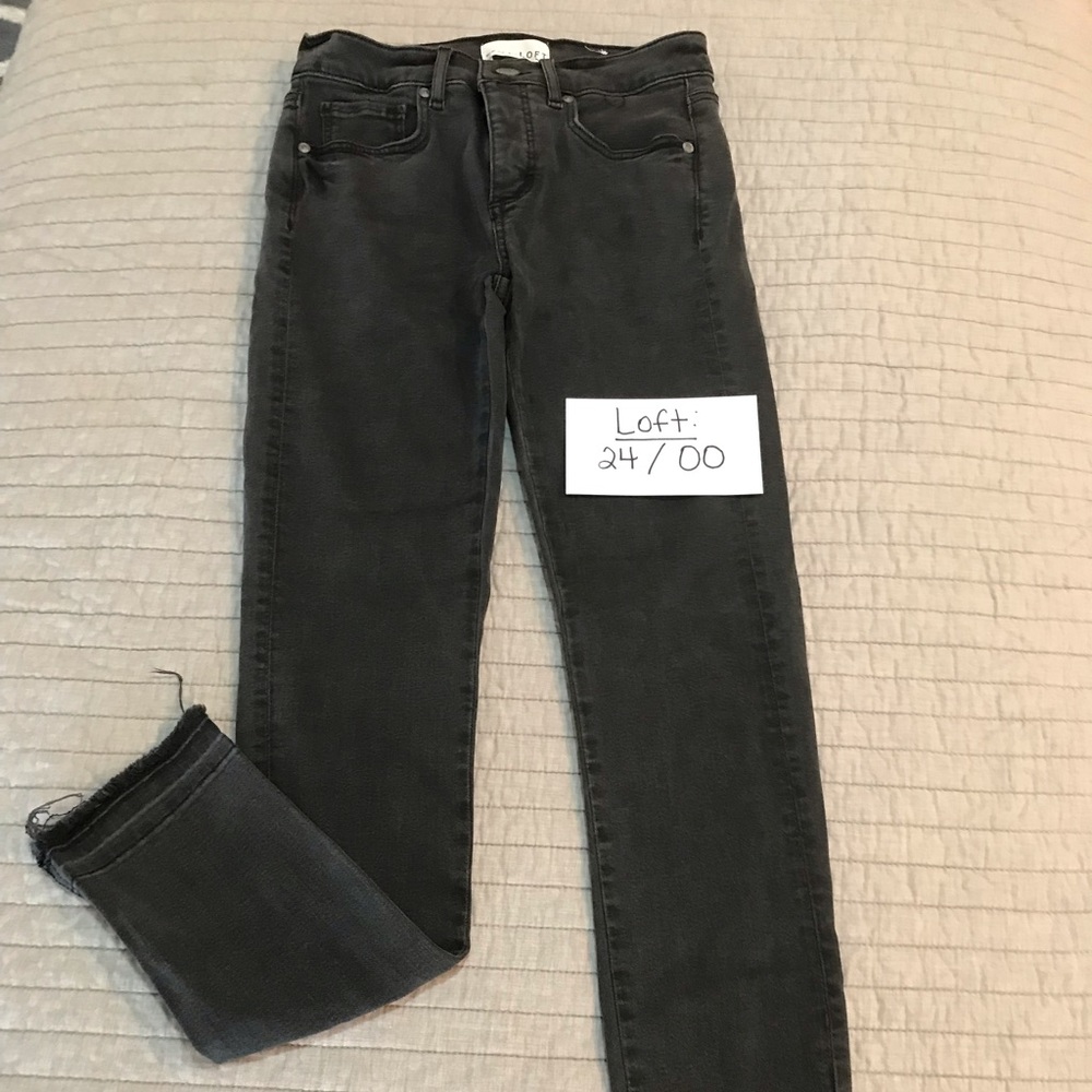 Loft. Modern skinny black jeans. Size 24 00. Raw hem slit at cuff. Excellent.